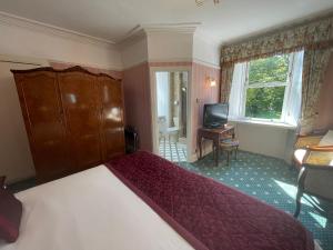 Postel nebo postele na pokoji v ubytování Ravenscourt House, Guest House