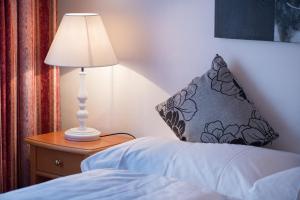 
Ein Bett oder Betten in einem Zimmer der Unterkunft Hotel Restaurant Schlössli
