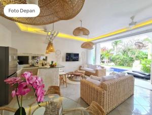 a living room with a couch and a table at Cozzy room in heart of Canggu#1 in Canggu