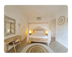 a bedroom with a white bed and a table and a mirror at Cozzy room in heart of Canggu#1 in Canggu +27 photos