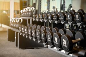 a row of dumbbells in a gym at Grand Hotel View in Postira
