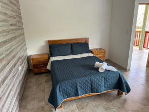 Postel nebo postele na pokoji v ubytování KETHALYA TAYRONA Hostal