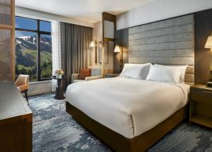 a hotel room with a bed and a large window at Grand Hyatt Deer Valley in Park City +87 photos