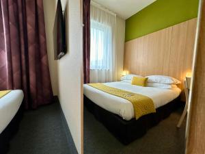 Postel nebo postele na pokoji v ubytování B&B HOTEL Metz Est Technopole Pôle Santé