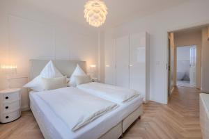 En eller flere senge i et værelse på Hanse Villa - Apartment Bremen