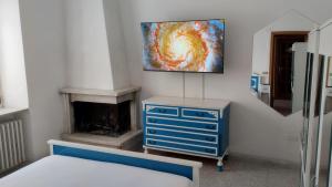 Televízia a/alebo spoločenská miestnosť v ubytovaní Interstellar