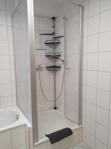 a bathroom with a shower and a sink at 115qm Wohnparadies in Herbolzheim