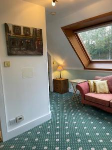 Posezení v ubytování Ravenscourt House, Guest House