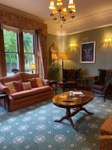 Posezení v ubytování Ravenscourt House, Guest House