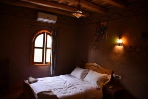 Postel nebo postele na pokoji v ubytování Gîte d'étape Tamaloute