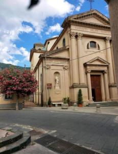 a large building with a statue in front of it at Cottage Gole Alcantara D’amore in Graniti +27 photos