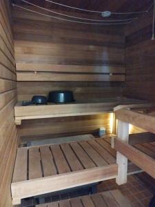 a sauna with two pans on top of it at SAGA Modern Apartment with 24-7 Check-in in Kristiinankaupunki