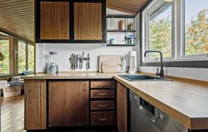 a kitchen with a sink and a counter top at Nice Home In Gørlev With Wifi in Gørlev