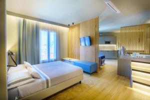 Postel nebo postele na pokoji v ubytování Atarassia suite luxury
