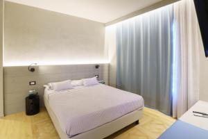 Postel nebo postele na pokoji v ubytování Atarassia suite luxury