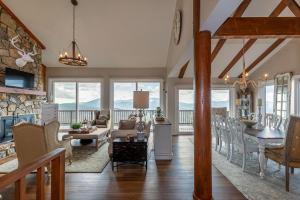 a kitchen and living room with a table and chairs at Grandview Haven in Banner Elk