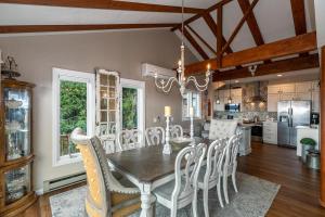 a dining room and kitchen with a table and chairs at Grandview Haven in Banner Elk +34 photos