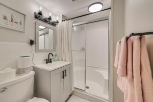 a bathroom with a toilet sink and a shower at Gaylord Family Home Walk to Shops and Restaurants! in Gaylord +18 photos