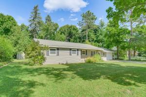 a home in a subdivision with a large yard at Gaylord Family Home Walk to Shops and Restaurants! in Gaylord