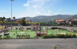 a playground with tables and chairs in a park at Villa Rossella in Gaggi +19 photos