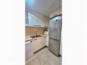 Kuchyň nebo kuchyňský kout v ubytování Apartament Calella