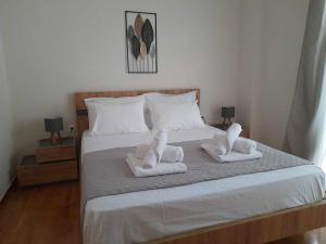 Postel nebo postele na pokoji v ubytování Irene Luxe Loft
