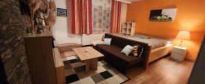 Posezení v ubytování Familienfreundliche Ferienwohnung Eulennest