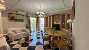 a living room with a table and a couch at Piso en Arenas Velez-Malaga by BRISAMAR Holidays in Málaga
