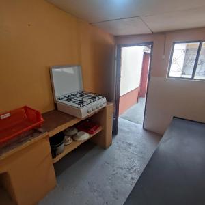 Kuchyň nebo kuchyňský kout v ubytování Conexión Urbana en el centro de Ambato