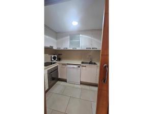 Kuchyň nebo kuchyňský kout v ubytování Apartament Calella