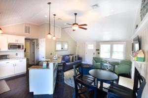 a kitchen and living room with a couch and a table at Beautiful Home Walk to Water Dog Welcome in Yarmouth +20 photos