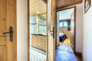 a bathroom with a sink and a mirror at Les Chalets Du Gypse - LES CHALETS DU GYPSE C04 MAE-3901 in Saint-Martin-de-Belleville +16 photos
