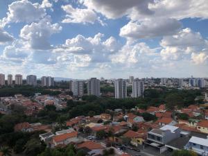 a city with buildings and clouds in the sky at Flat Red Sorocaba - Gray in Sorocaba