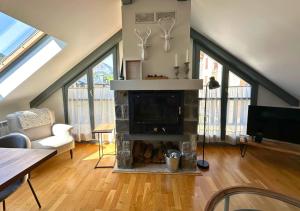 Posezení v ubytování Caldares Exclusivo Ático en El Pueyo de Jaca