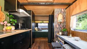 a kitchen and living room in a tiny house at Piccolo Lane Daylesford in Daylesford