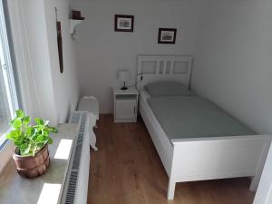 Ένα ή περισσότερα κρεβάτια σε δωμάτιο στο Altes Backhaus +3 φωτογραφίες