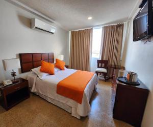 Postel nebo postele na pokoji v ubytování Hotel Anaconda