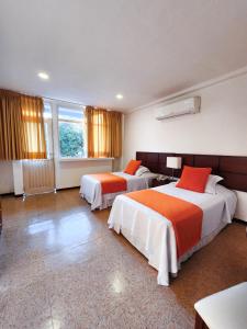 Postel nebo postele na pokoji v ubytování Hotel Anaconda