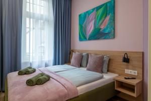 Posteľ alebo postele v izbe v ubytovaní Budapest Holidays Downtown