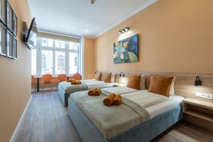 Posteľ alebo postele v izbe v ubytovaní Budapest Holidays Downtown
