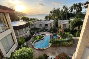 an aerial view of a house with a swimming pool at 3BR Condo in Rawai, Phuket with Exclusive Beach in Ban Saiyuan (1)
