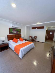 Postel nebo postele na pokoji v ubytování Hotel Anaconda