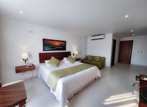 Postel nebo postele na pokoji v ubytování Hotel Anaconda
