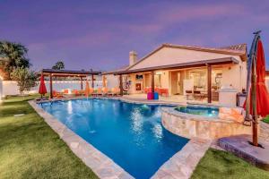 a swimming pool in front of a house at Casa Malca Tulum in Indio