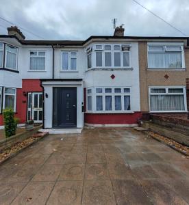 an empty driveway in front of a house at 4 Bedroom 2 Bathroom House - Free parking in Ponders End