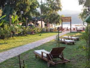 a group of benches sitting in a park at Sakin Vadi Winehouse in Orhaniye