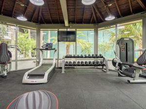 a gym with treadmills and machines in a room at Chilling 1BR Home in Orlando Next to Disney in Vineland