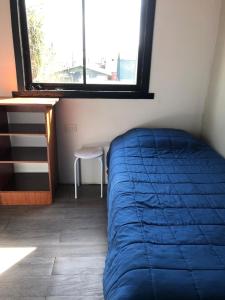 Postel nebo postele na pokoji v ubytování Cabaña a pasos de la costanera con estacionamiento