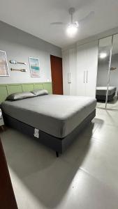 a bedroom with a large bed in a room at Residencial Marina clube D205 in São Pedro da Aldeia +85 photos