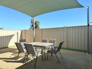 a table and chairs under a canopy on a patio at Unit 59 Seafront Estate in Jurien Bay